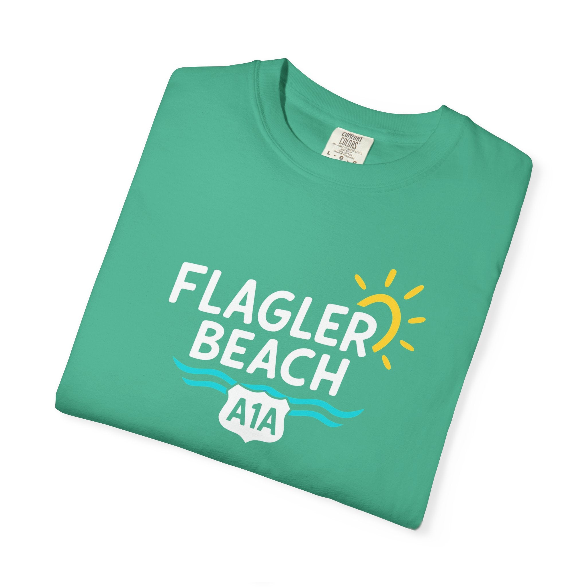 Green t-shirt with 'Flagler Beach A1A' text and graphics on a white background