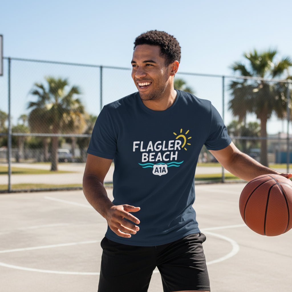 Man holding a basketball on a court wearing a 'Flagler Beach' t-shirt.